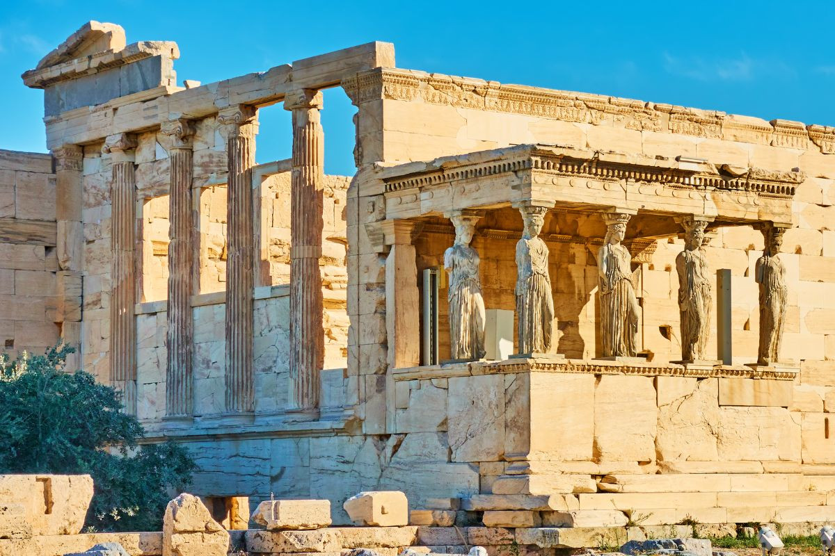 The Erechtheion of Athens, featuring Caryatid statues and ancient Greek columns.